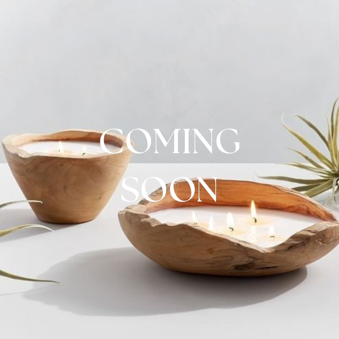 Scented High Tide candle in a glass jar with a natural-colored wax and a burning wick, ideal for cozy home ambiance.